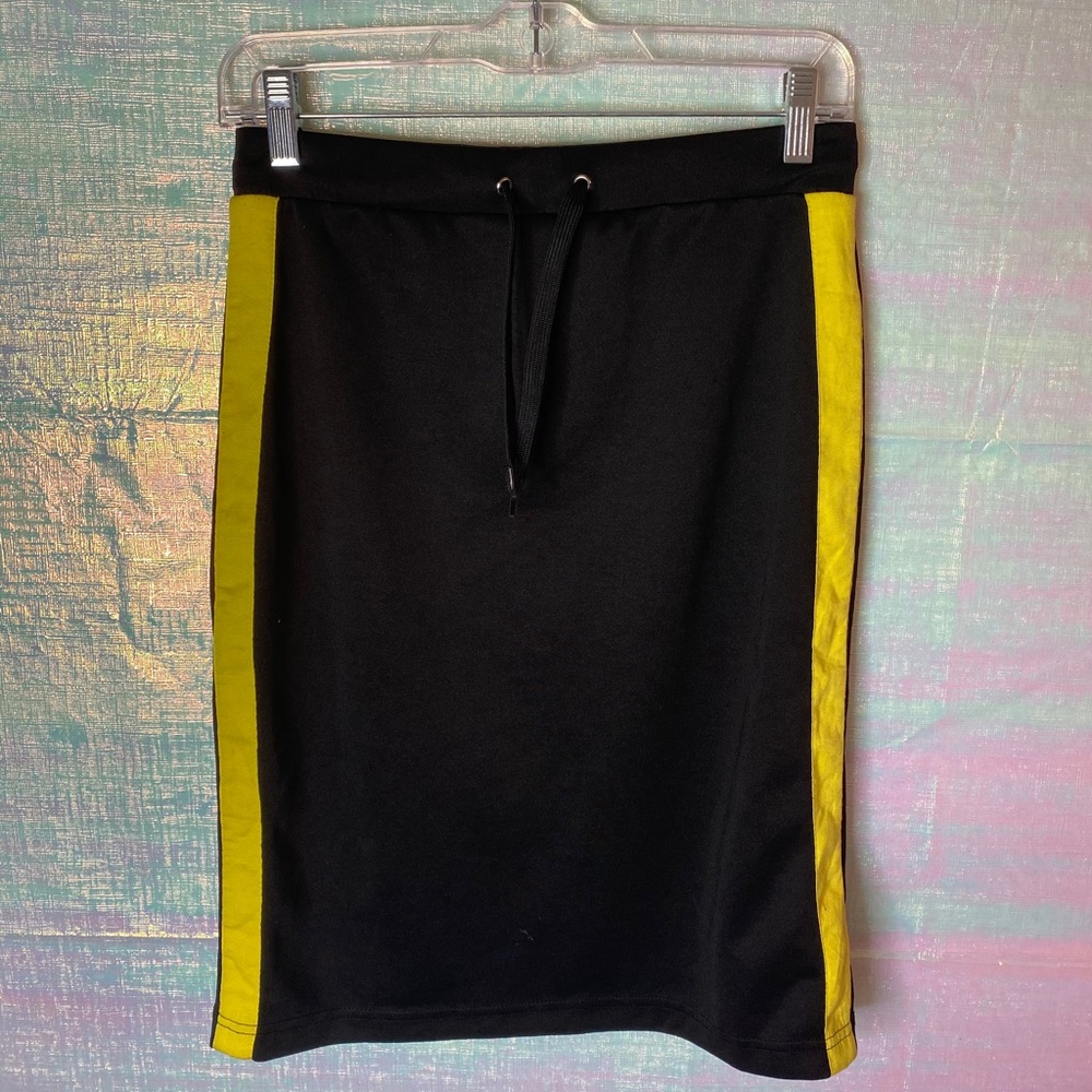 Black and stripped yellow skirt